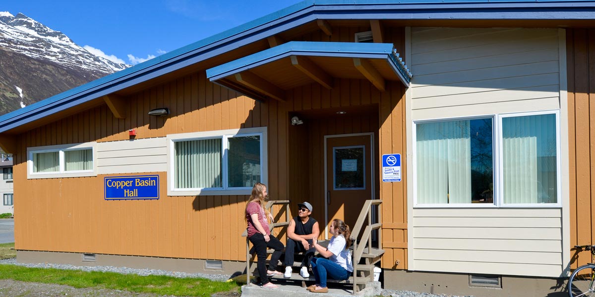 Students infront of student housing at Prince William Sound College (PWSC) in Valdez, Alaska