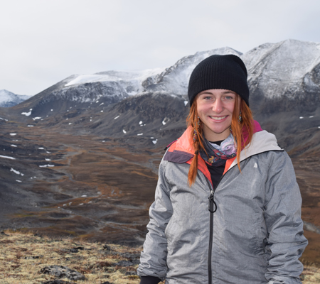 Outdoor leadership student Amanda Wygant standing in the mountains in Alaska