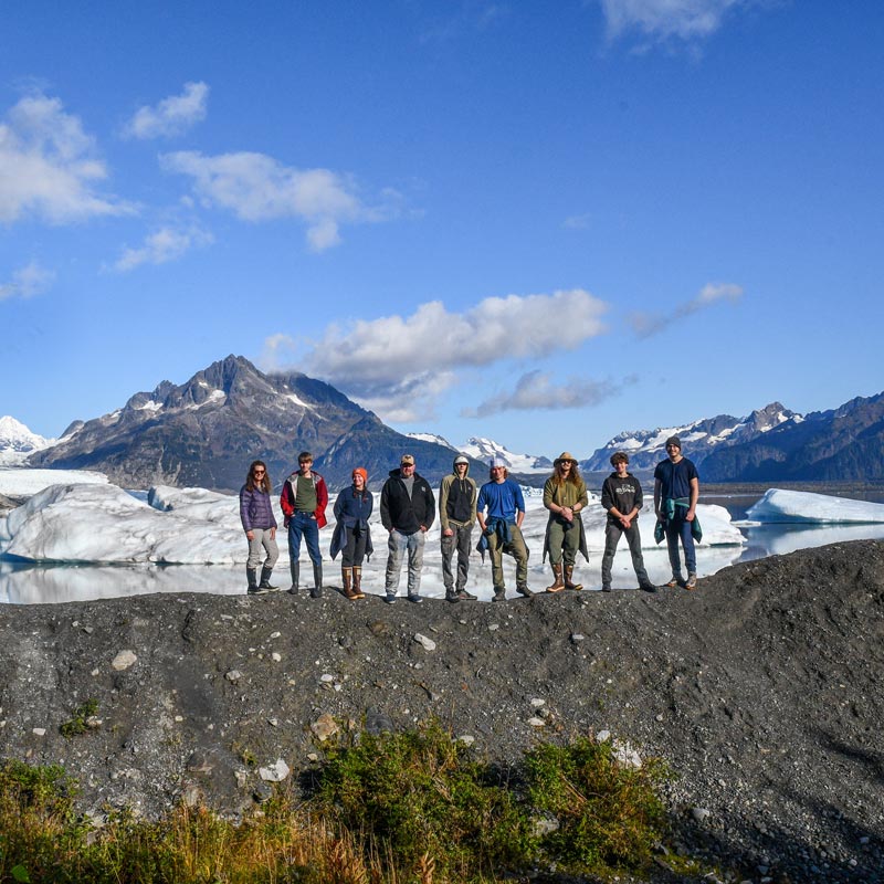 students standing in front of a glacier