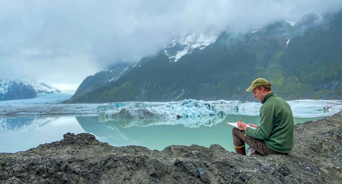 PWSC student studying near a glacier