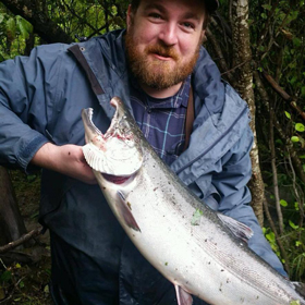 PWSC student Eric Cooper holds a salmon