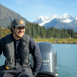 Student on the water in a skiff. 