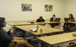 Teacher and students discussing English class topics. 