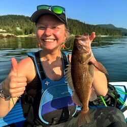 Girl with fish in her hand. 