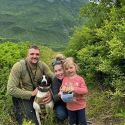 Man and woman and child outside.