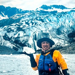 Man with glacier ice in his hand.