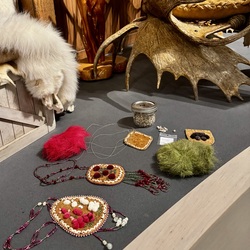 Crafts displayed on a table. 