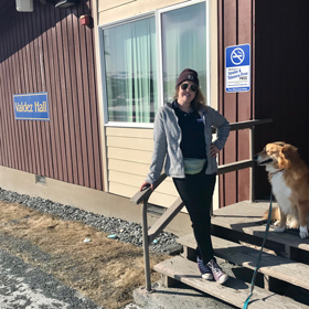 Sam Foist-Swart in front of Prince William Sound College (PWSC) residence halls in Valdez, Alaska