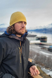Man staring at the horizon outdoors. 