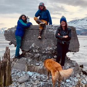 Rodrigo, Joe, and Sam, all PWSC residence life staff, stand on a beach in Valdez, Alaska