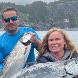 Two adults with fish.