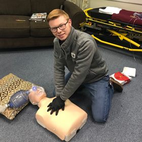 Andrew Bradley practices CPR 