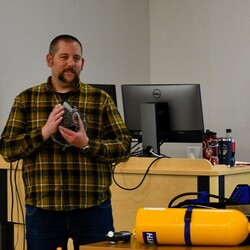 Man teaching about protective gear.