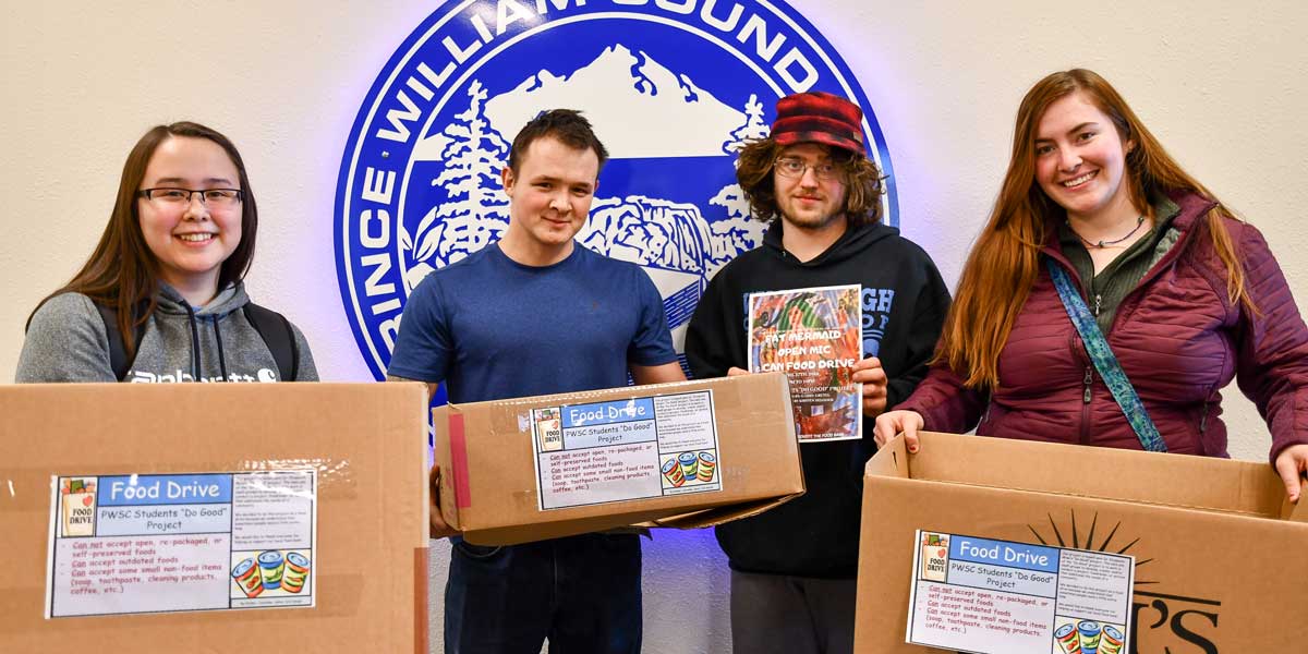 PWSC students holding boxes to collect food donations