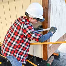 Construction student volunteer on tiny home project in Valdez, Alaska at Prince William Sound College