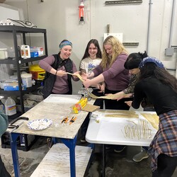 Group of students making pasta.