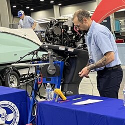 Man working on an outboard. 