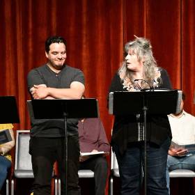 actors performing a play with script on stands